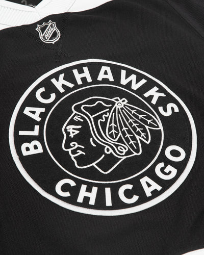 Autographed Chicago Blackhawks Philip Kurashev team issued alternate jersey - front detail view