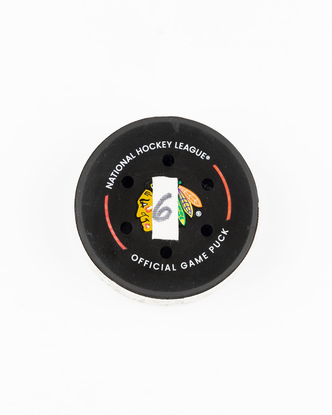 official Chicago Blackhawks game used hockey goal puck scored by Chicago Blackhawks player Nick Foligno against Montreal Canadiens on January 3, 2025 - front lay flat