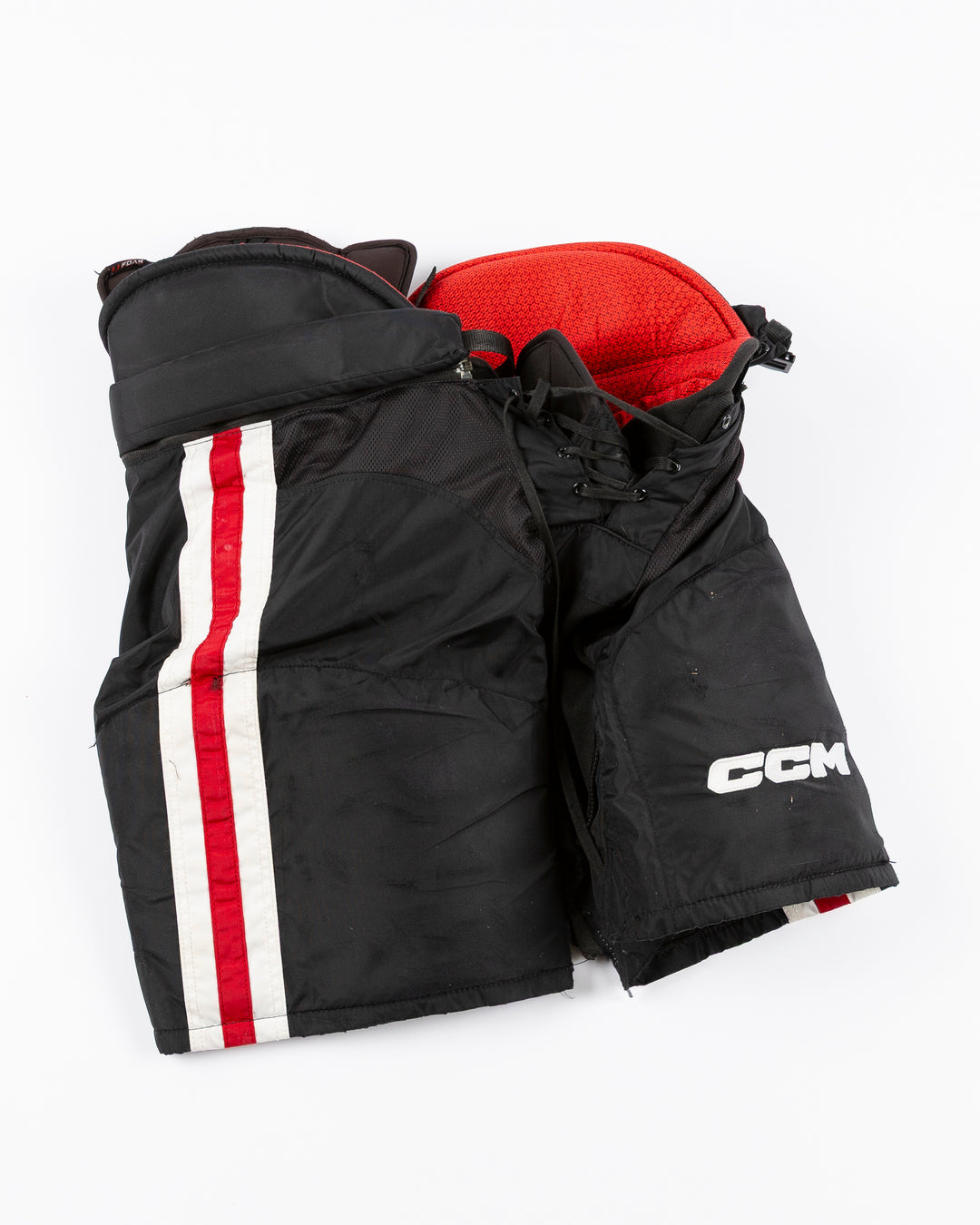 black CCM hockey pants used by Chicago Blackhawks player Ryan Donato - front lay flat