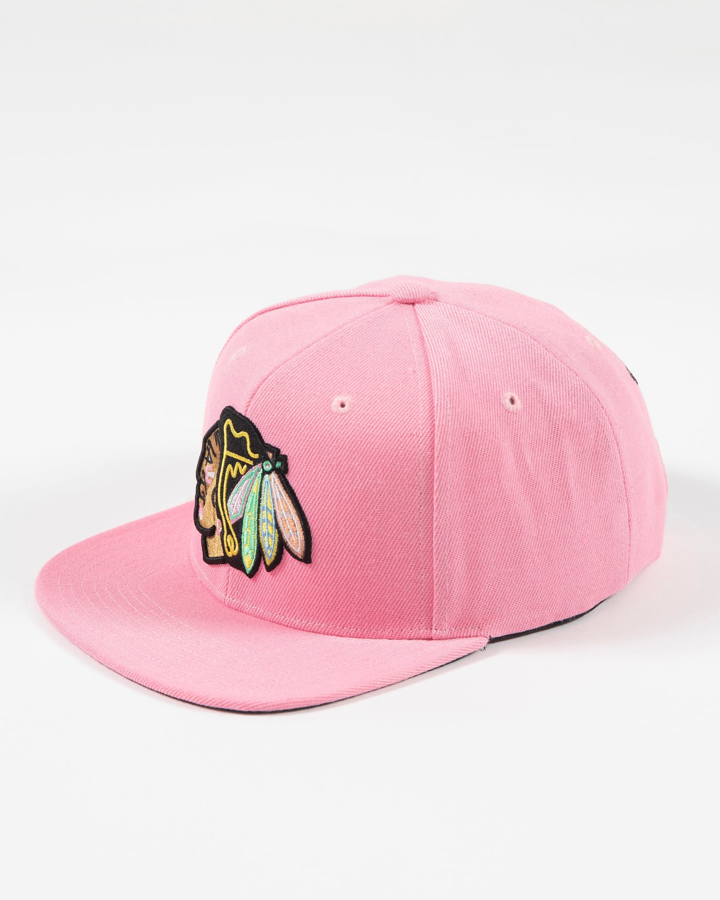 Mitchell & Ness pink snapback with Chicago Blackhawks primary logo embroidered on the front with pink accents - left angle lay flat