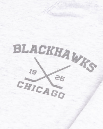 grey Line Change hoodie with Chicago Blackhawks hockey sticks graphic on left chest - detail lay flat