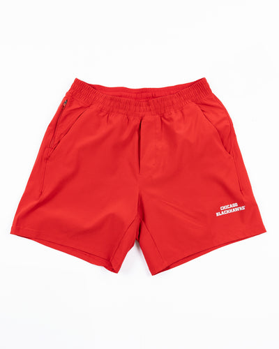 red lululemon men's shorts with Chicago Blackhawks wordmark printed on left leg - front lay flat