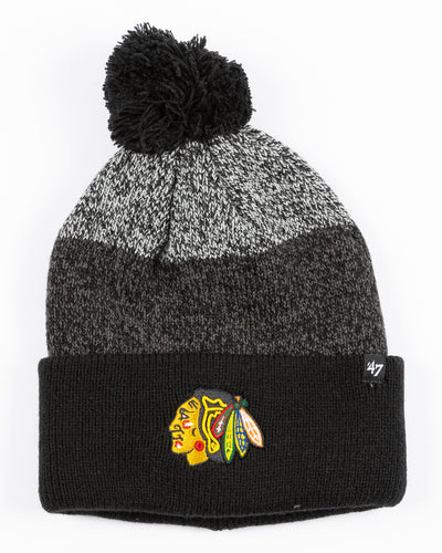 black and grey color blocked knit hat with Chicago Blackhawks primary logo embroidered on cuff with black pom - front lay flat