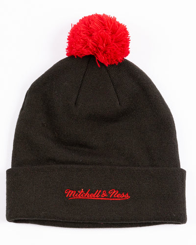 black youth Mitchell & Ness knit hat with Chicago Blackhawks primary logo on front and embroidered wordmark on cuff and red pom - back lay flat
