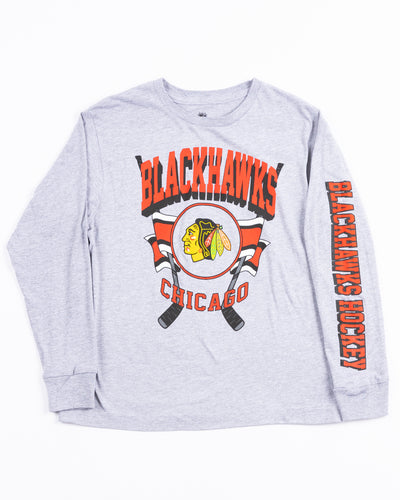grey youth long sleeve tee with Chicago Blackhawks wodmark on left arm and primary logo hockey sick graphic across chest - front lay flat