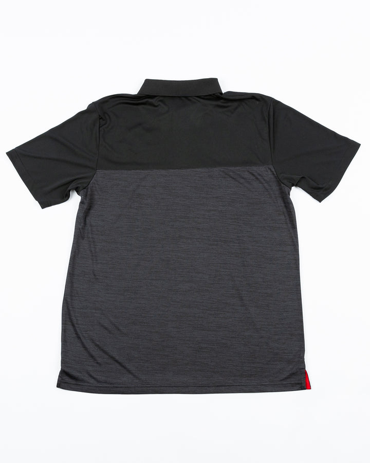 black Colosseum polo with red and white stripes across top and embroidered Rockford IceHogs logo on left chest - back lay flat