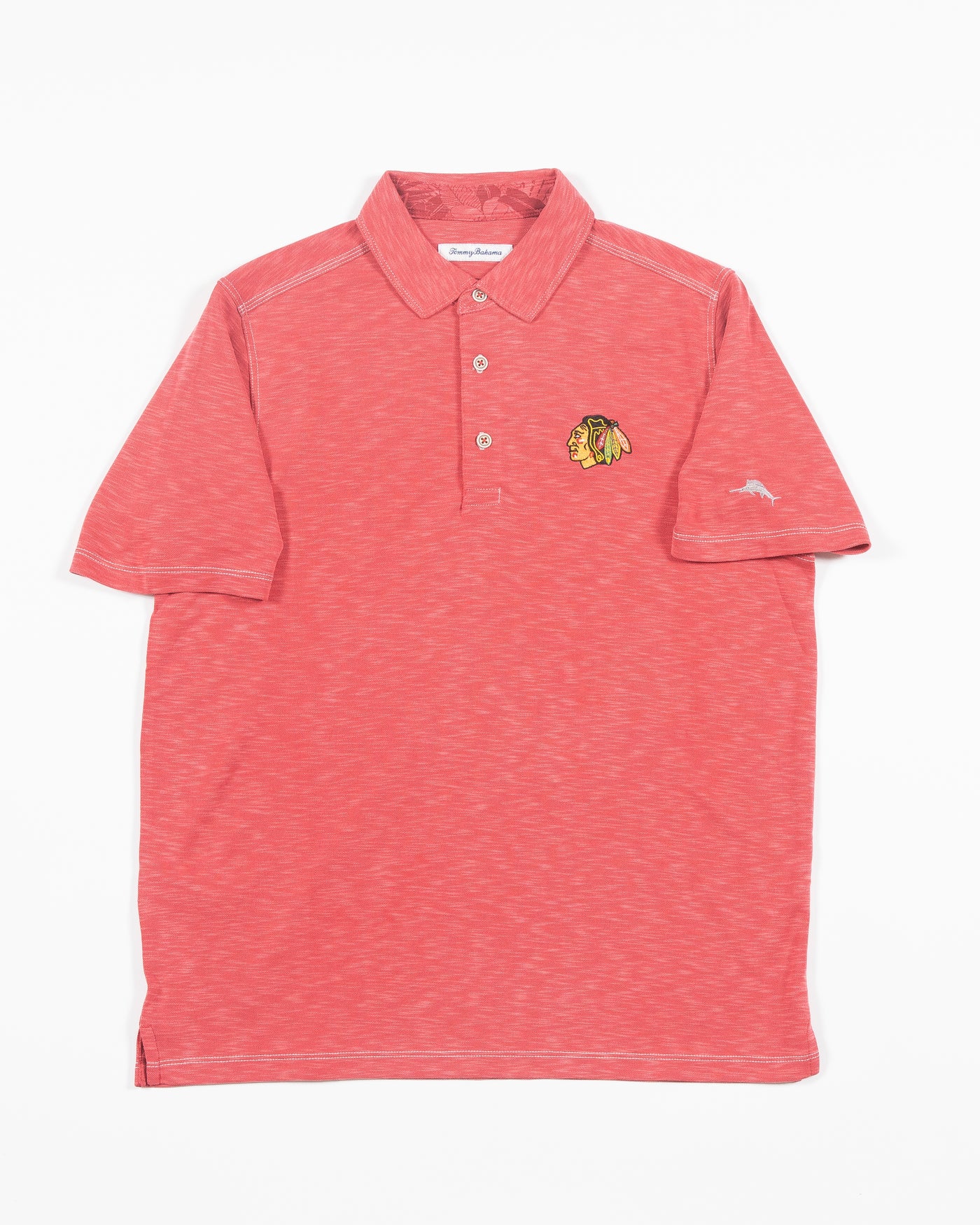 red Tommy Bahama polo with Chicago Blackhawks primary logo embroidered on left chest - front lay flat