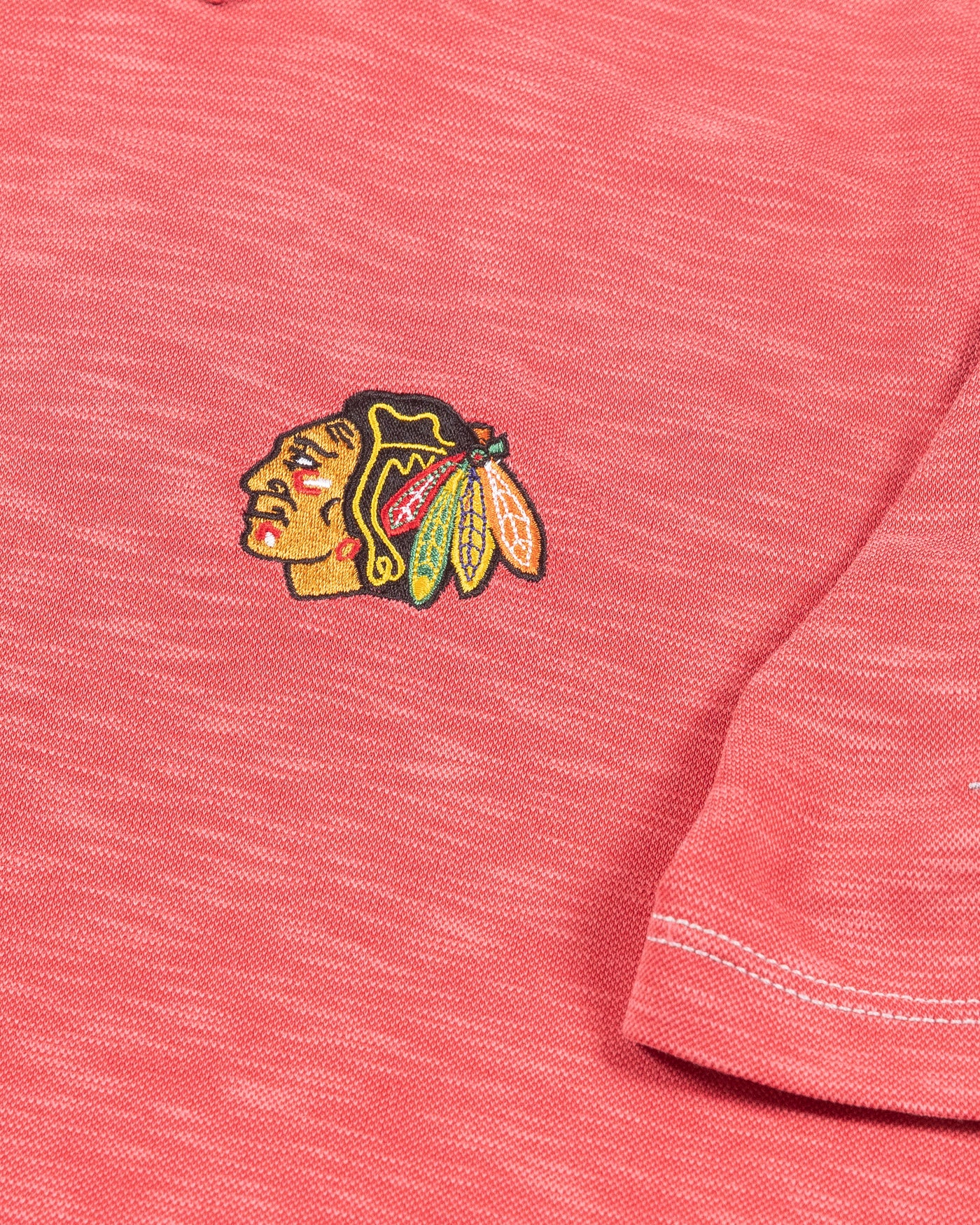 red Tommy Bahama polo with Chicago Blackhawks primary logo embroidered on left chest - detail logo lay flat