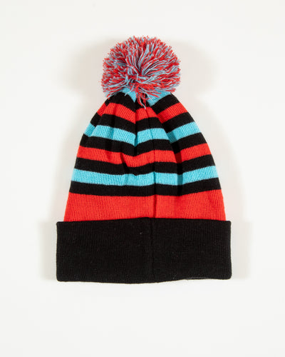 Four Stars knit hat with stripes and pom and Chicago Blackhawks primary logo in Chicago flag inspired colorway - back angle lay flat
