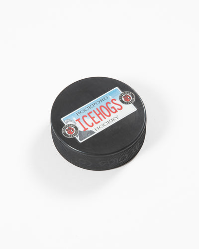 black hockey puck with Rockford IceHogs license plate inspired design - angled lay flat