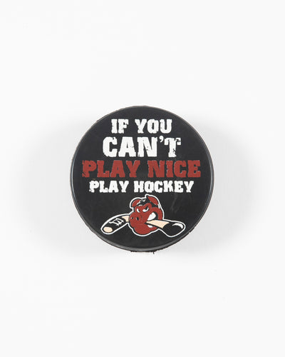 black hockey puck with Rockford IceHog Hammy and If You Can't Play Nice Play Hockey wordmark - front lay flat
