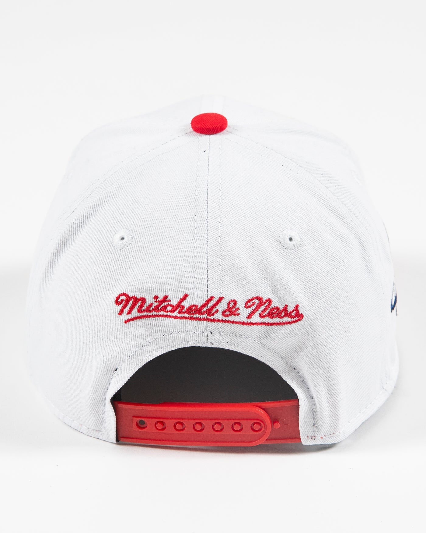 white and red Mitchell & Ness youth snapback with Chicago Blackhawks wordmark and primary logo embroidered on front - back lay flat