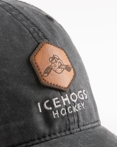 faded black adjustable cap with leather Hammy ptch and embroidered IceHogs Hockey wordmark - detail lay flat