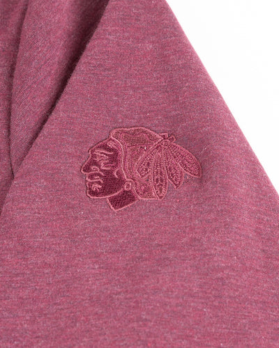 washed red TravisMathew quarter zip with Chicago Blackhawks primary logo embroidered on left shoulder - detail lay flat
