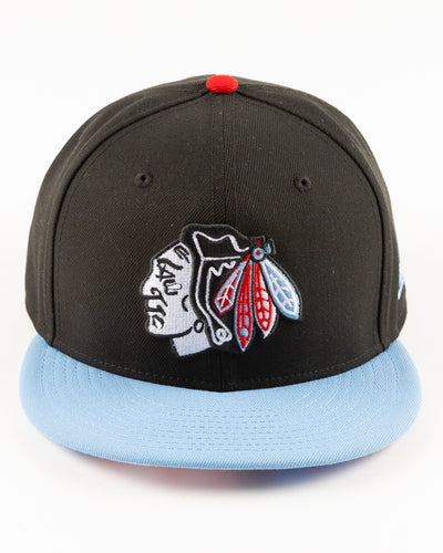 black and blue New Era fitted cap with tonal Chicago Blackhawks primary logo on front - front lay flat