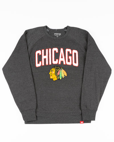 black Sportiqe crewneck with Chicago Blackhawks primary logo and Chicago wordmark embroidered in chenille - front lay flat
