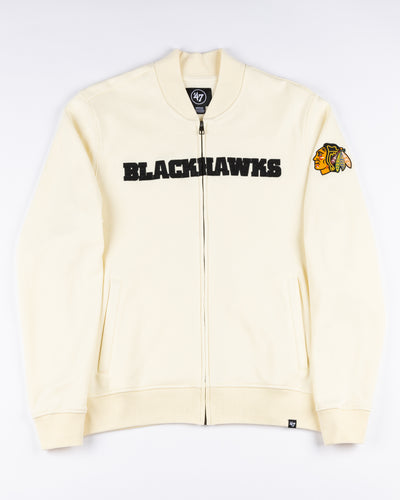cream '47 brand full zip varsity jacket with Chicago Blackhawks wordmark across chest and primary logo on left shoulder - front lay flat