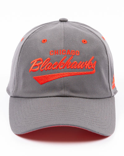 grey adidas adjustable cap with red Chicago Blackhawks wordmark and secondary logo - front lay flat