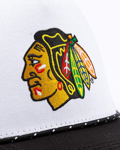 two tone black and white Gongshow trucker hat with rope detail and Chicago Blackhawks primary logo embroidered on the front - detail lay flat