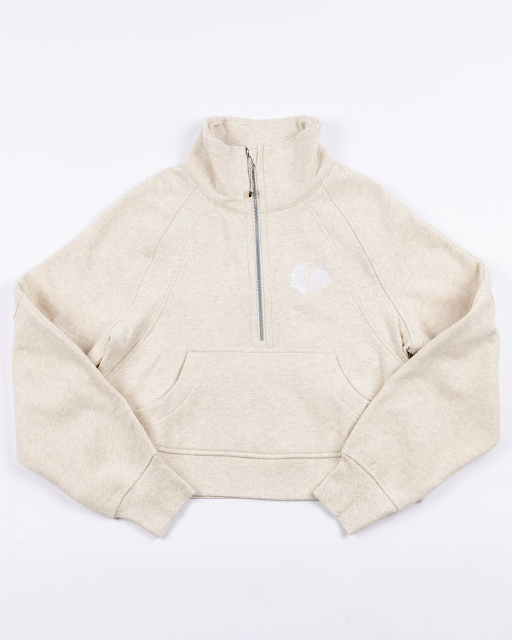 cream lululemon half zip with Chicago Blackhawks primary logo embroidered on left chest - front lay flat
