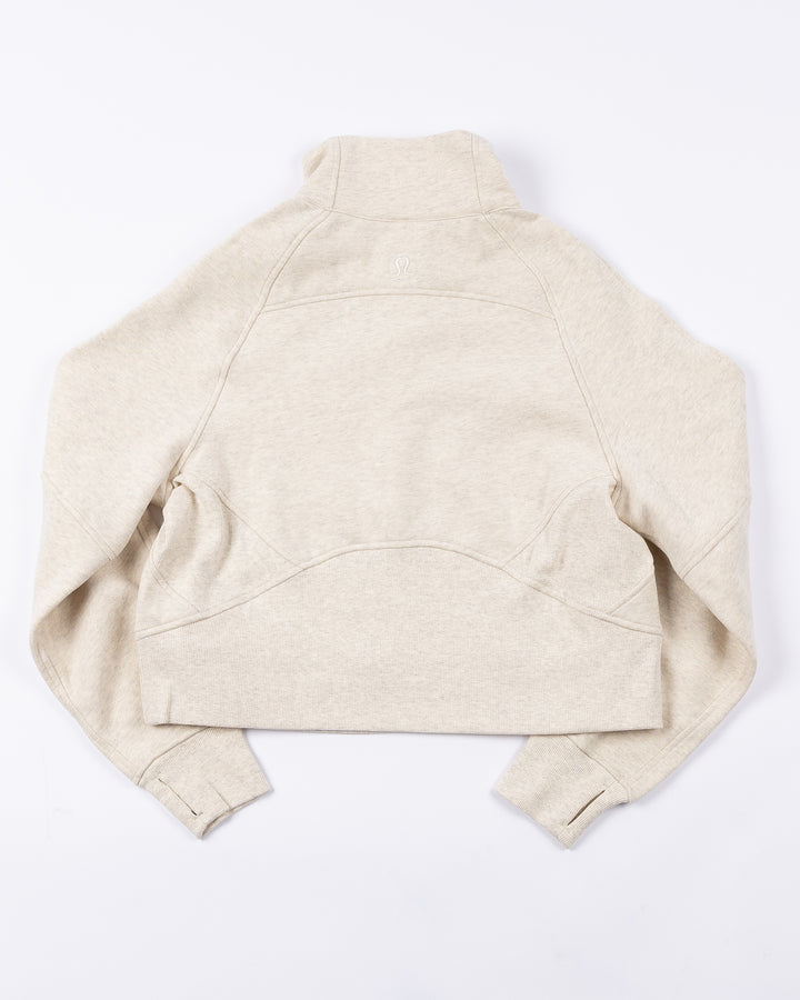cream lululemon half zip with Chicago Blackhawks primary logo embroidered on left chest - back lay flat