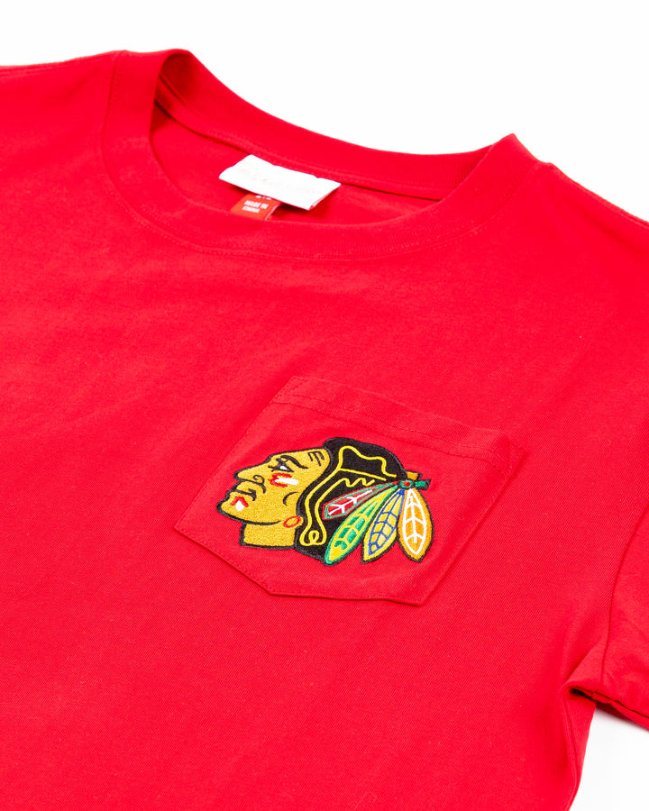 red Mitchell & Ness short sleeve tee with Chicago Blackhawks primary logo on left chest pocket - front detail lay flat
