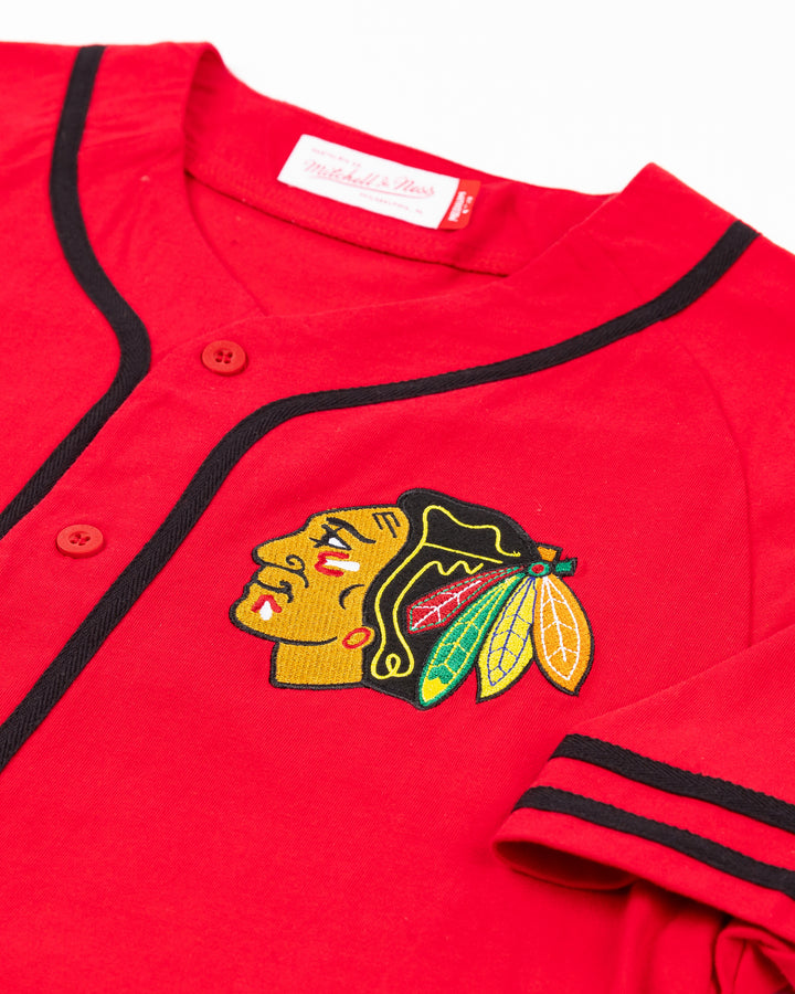 red Mitchell & Ness baseball-inspired button shirt with Chicago Blackhawks primary logo embroidered on left chest - front detail lay flat