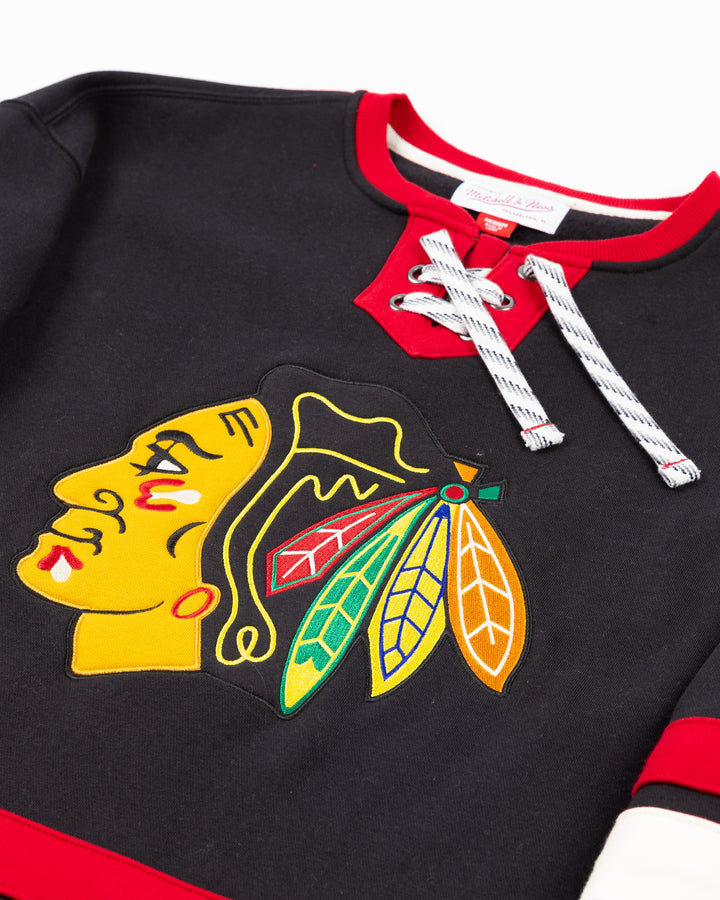 black red and white Mitchell & Ness hockey jersey inspired crewneck with lace detail and Chicago Blackhawks primary logo on front, NHL Western Conference on right shoulder and secondary logo on left shoulder - front detail lay flat