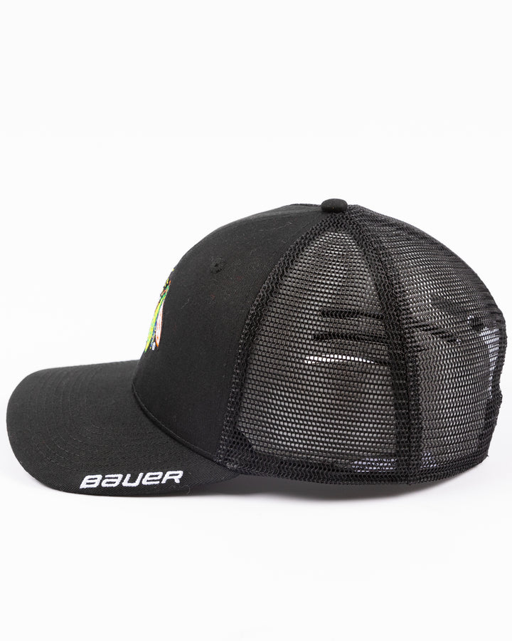 black Bauer adjustable mesh snapback trucker hat with Chicago Blackhawks primary logo embroidered on front - left side lay flat