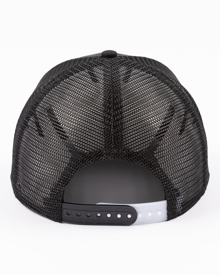 black Bauer adjustable mesh snapback trucker hat with Chicago Blackhawks primary logo embroidered on front - back lay flat