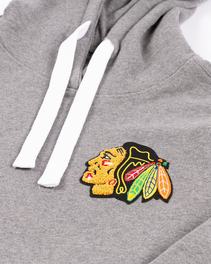 grey Sportiqe hoodie with chenille embroidered Chicago Blackhawks logo on left chest - front detail lay flat