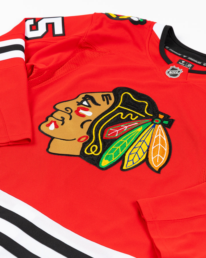 red Fanatics Premium Chicago Blackhawks Home Jersey with Artyom Levshunov name and number 55 - front detail lay flat