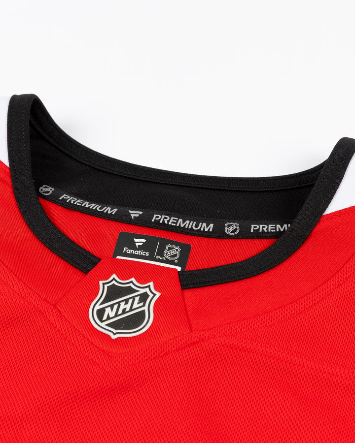 red Fanatics Premium Chicago Blackhawks Home Jersey with Artyom Levshunov name and number 55 - neckline detail lay flat