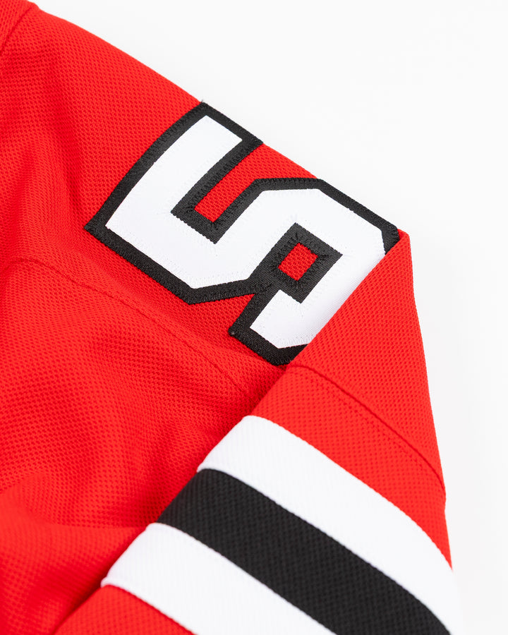 red Fanatics Premium Chicago Blackhawks Home Jersey with Artyom Levshunov name and number 55 - shoulder detail lay flat