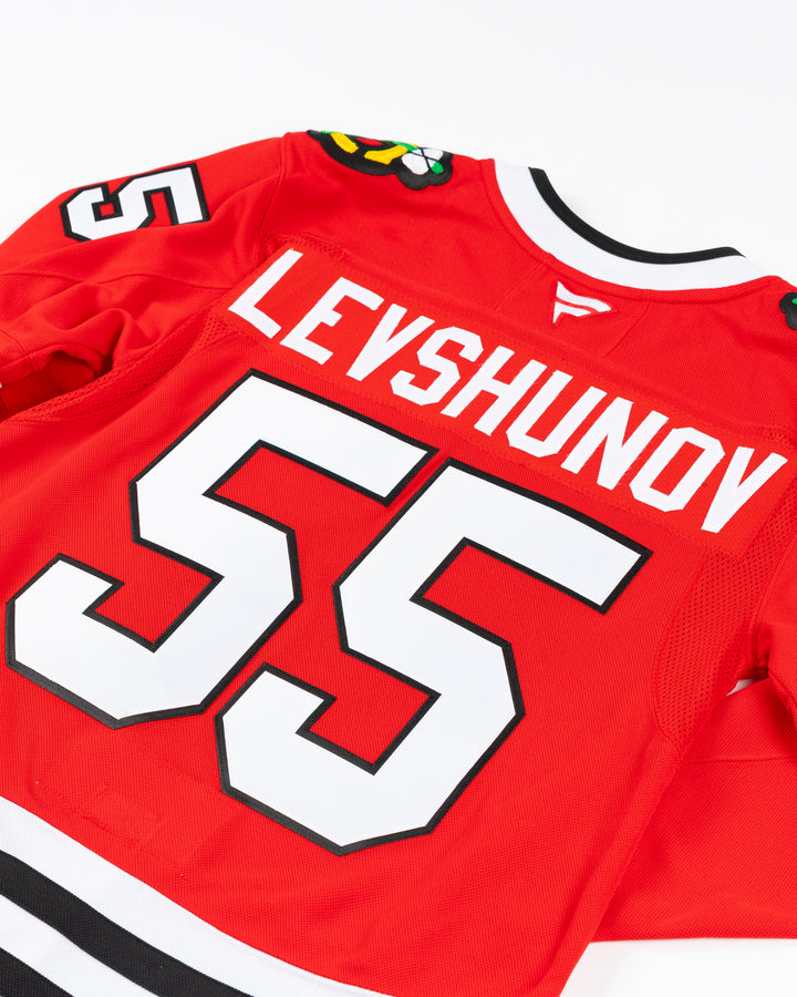 red Fanatics Premium Chicago Blackhawks Home Jersey with Artyom Levshunov name and number 55 - back detail lay flat