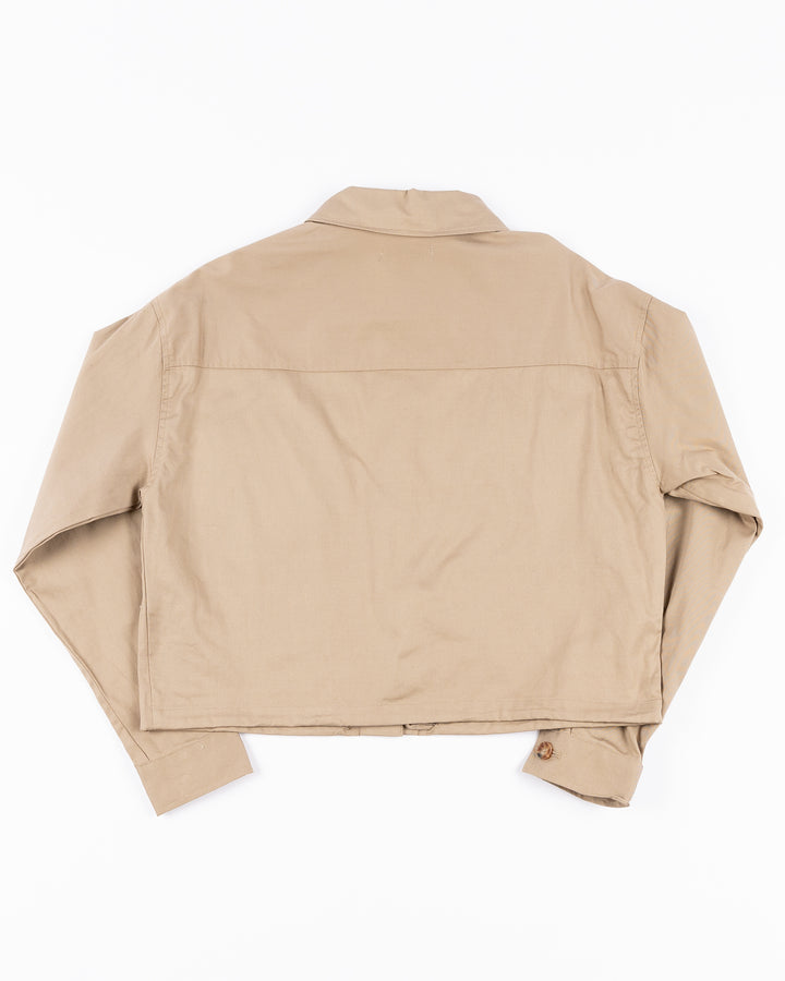 beige WEAR by Erin Andrews women's button down cropped shirt with Chicago Blackhawks wordmark and primary logo on left chest pocket - back lay flat