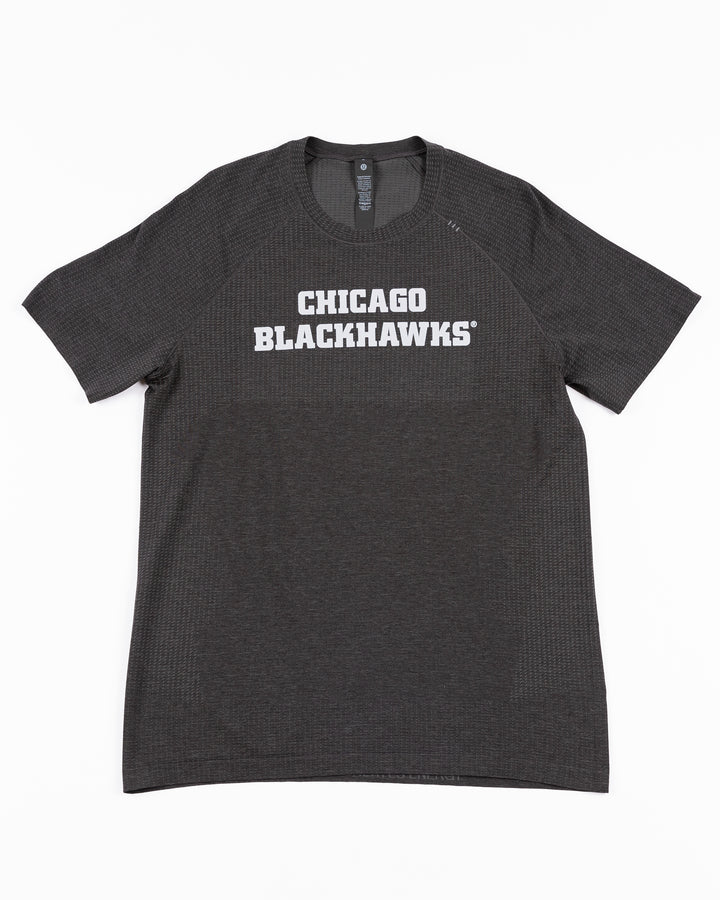 black lululemon short sleeve tee with Chicago Blackhawks wordmark across front - front lay flat