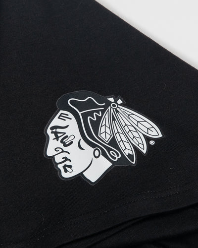 black lululemon short sleeve tee with Chicago Blackhawks tonal primary logo on left shoulder - detail lay flat