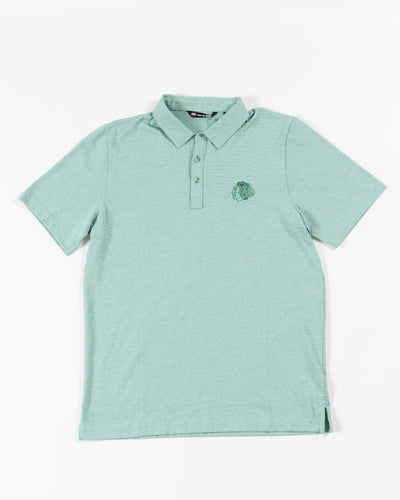 TravisMathew Chicago Blackhawks green polo with embroidered tonal primary logo - front lay flat