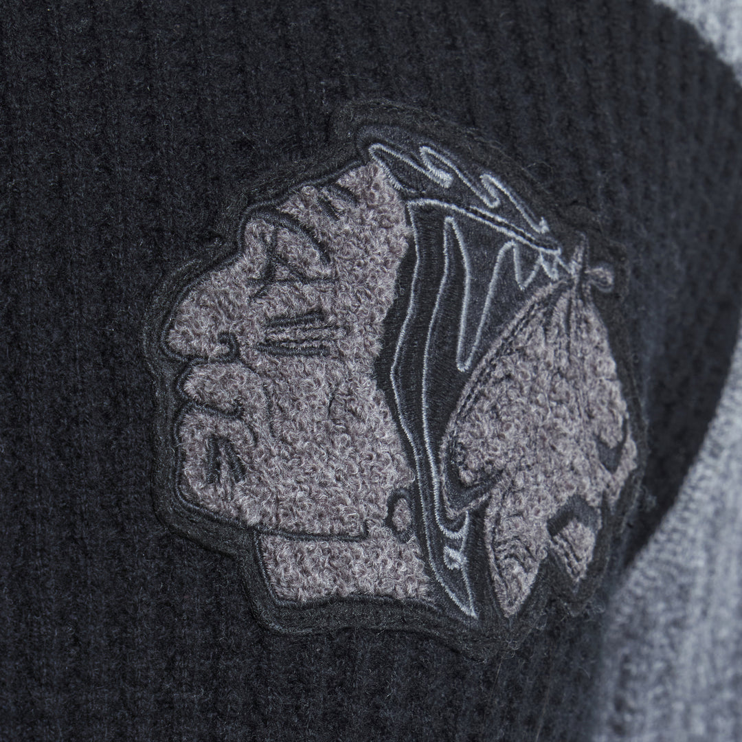 Todd Snyder x Chicago Blackhawks in partnership with Fanatics striped black and grey cashmere rugby polo sweater with vintage chenille Chicago Blackhawks logo on left chest - chenille patch detail image