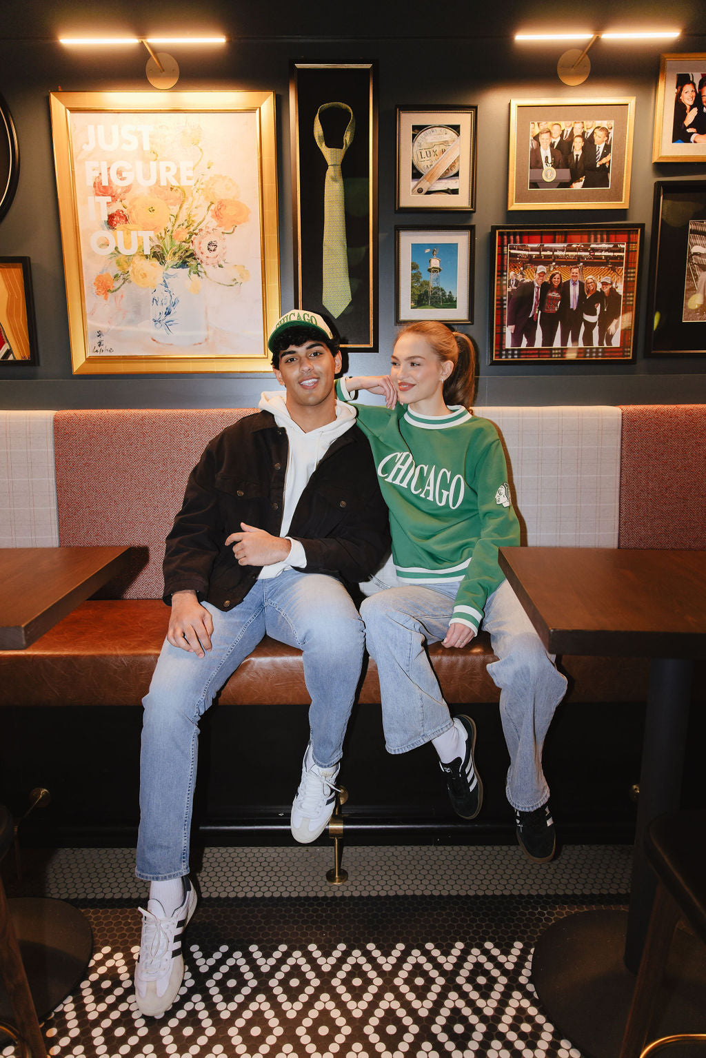 woman wearing green Alice & Wonder crewneck sweater with Chicago wordmark graphic and tonal Chicago Blackhawks primary logo on left shoulder