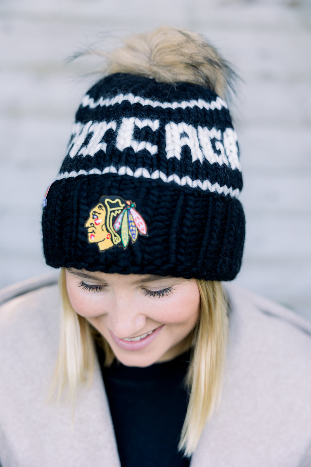 black Chicago Blackhawks beanie with detachable tan pom - alt lifestyle imagery