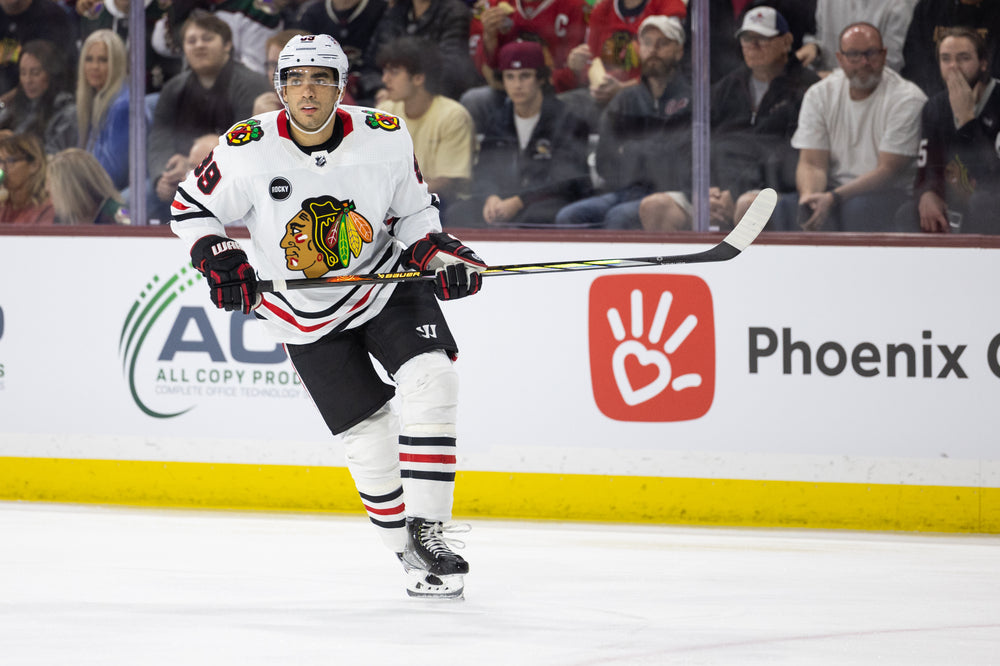 Chicago Blackhawks player Andreas Athanasiou in white away jersey against Arizona