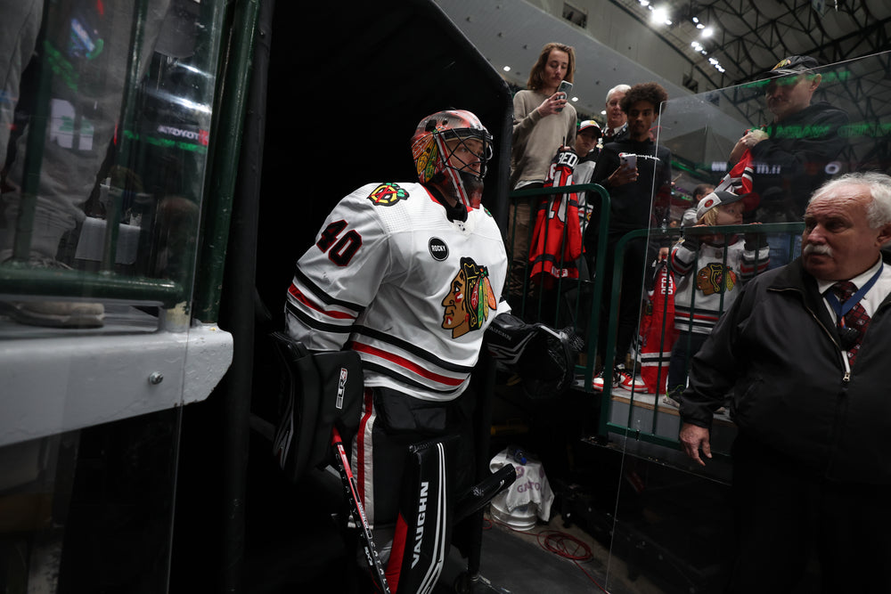 Arvid Soderblom in white adidas Chicago Blackhawks uniform at Dallas 