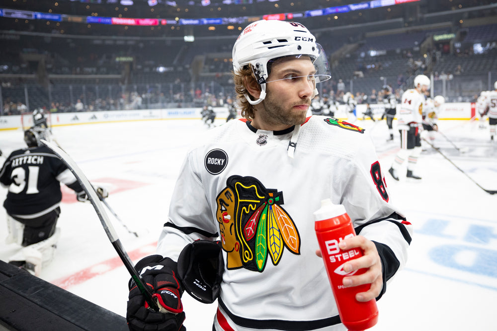 Landon Slaggert in white Chicago Blackhawks uniform at Los Angeles