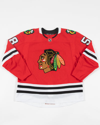 Autographed Chicago Blackhawks Mackenzie Entwistle team issued red jersey - front angle
