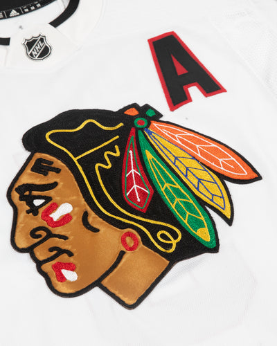 Autographed Chicago Blackhawks Connor Murphy tea issued white jersey - close up of front