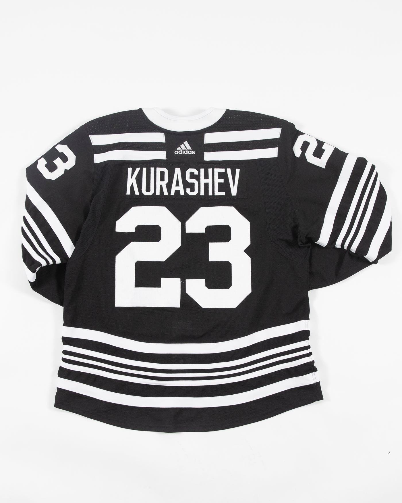 Autographed Chicago Blackhawks Philip Kurashev team issued alternate jersey - back view