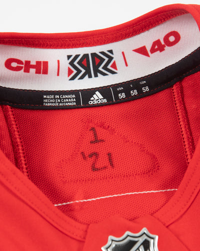 Autographed Chicago Blackhawks Kirby Dach team issued reverse retro jersey - neckline