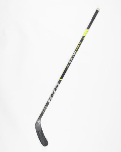 Autographed Chicago Blackhawks Caleb Jones game used hockey stick - full stick